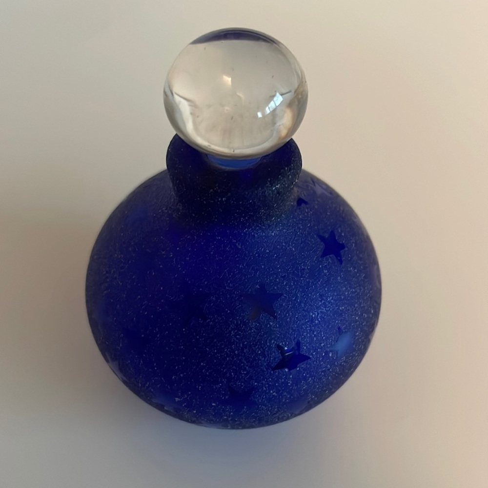 Beautiful perfume glass bottle. Blue with stars and clear glass stopper.
